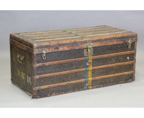 A late 19th century E. Goyard Aîné of Paris wooden bound trunk with overall printed canvas covering and brass studded mounts,
