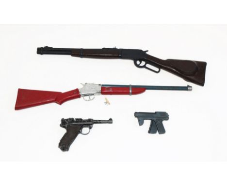 A plastic Marx rifle toy, a Lone Star Frontier Scout type rifle toy, a DCMT Papermatic capless automatic pistol, and a Lone S