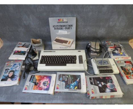 A COMMODORE VIC 20 COLOUR COMPUTER, untested, with power pack, joystick, data cassette and seven boxed games, to include Sarg