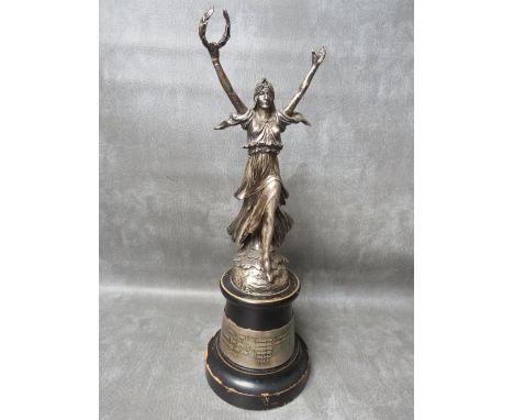 A HALLMARKED SILVER WF WITHERS TROPHY 'BRITISH CYCLE CORPORATION LTD', modelled as a female figure with arms outstretched hol