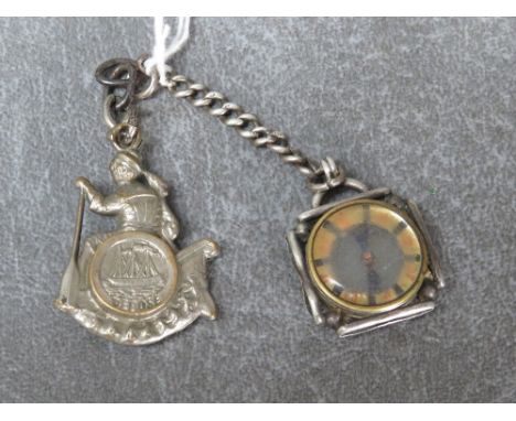 A 19TH CENTURY WHITE METAL MOUNTED COMPASS FOB, together with another white metal mounted compass fob depicting a figure hold