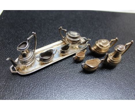 A MINIATURE HALLMARKED SILVER FOUR PIECE TEA AND COFFEE SERVICE ON TRAY, coffee pot mising lid, L 13 cm, together with a four