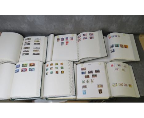 EIGHT STAMP ALBUMS, four containing Channel Island stamps (Jersey x2, Alderney and Guernsey, two containing  British stamps, 