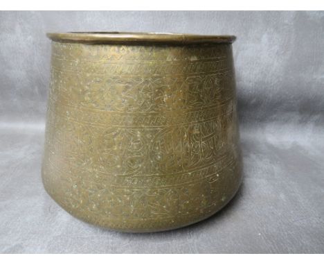 A 19TH CENTURY MAMLUK REVIVAL BRASS PLANTER, decorated with bands of Islamic script and repeating foliate designs, of taperin