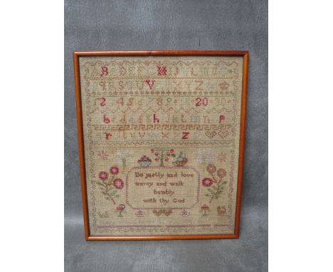 A 19TH CENTURY SAMPLER, framed and glazed, 31 x 26 cm