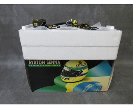 A BOXED MINICHAMPS 1:18 SCALE AYRTON SENNA COLLECTION LOTUS RENAULT 97T 1985 