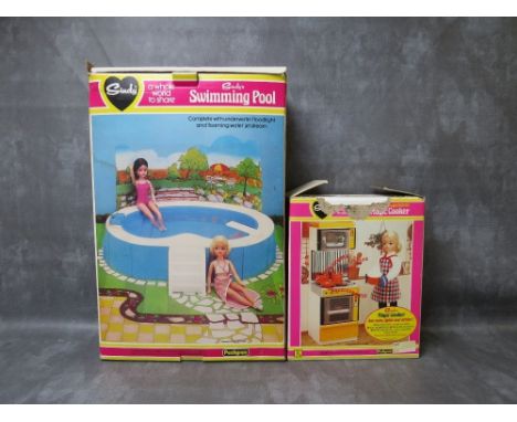 A BOXED PEDIGREE SINDY SWIMMING POOL WITH STEPS &amp; DIVING BOARD, together with a boxed Pedigree Sindy Magic Cooker, boxes 