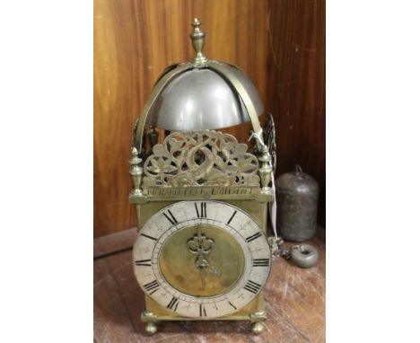 AN 18TH CENTURY BRASS LANTERN CLOCK, with silvered chapter ring engraved with Roman numerals, front spandrel inscribed 'Richa