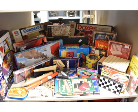 A large collection of retro board games, including pocket scrabble, pocket chess and checkers, mini dominoes an much, much mo