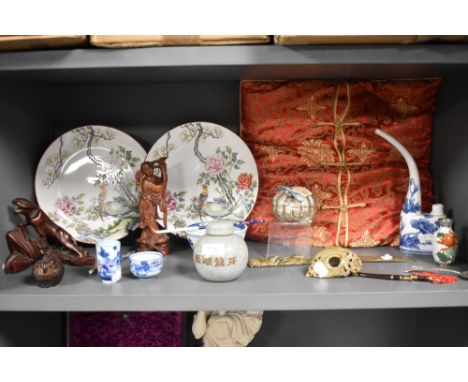 A selection of Chinese oriental ceramics and decorations including ginger jar, opium pipe, and silver spoon