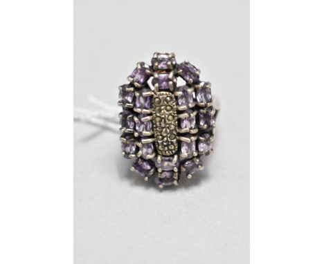 An oversized amethyst and marcasite multi stone ring of artisan form on a white metal loop stamped 925, size Q &amp; 12.7g