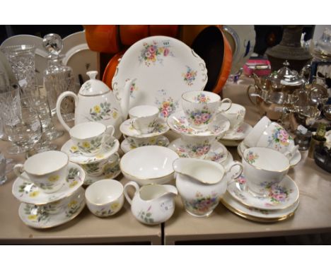 Two partial sets of tea service, including Adderley fine bone china cups, saucers,sugar basin and tea pot, having delicate wi