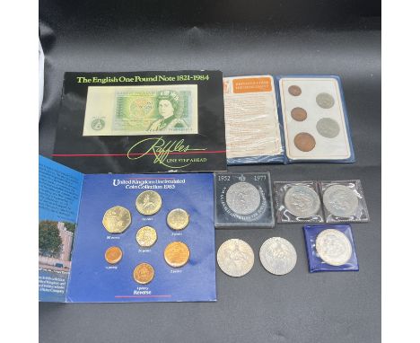 A collection of coins and a bank note,
a £1 bank note,
Heinz Royal Mint uncirculated coin collection 1983,
Britains first dec