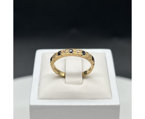 An 18ct yellow gold sapphire + diamond eternity ring,
2.9 grams in weight,
size M