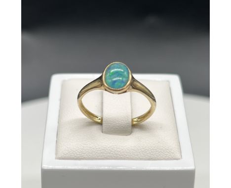 A 9ct yellow gold opal dress ring,
size R,
1.8 grams in weight