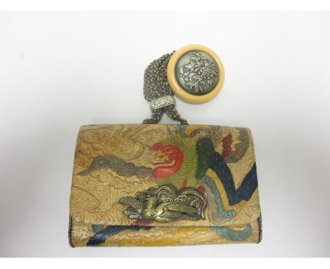 A Japanese embossed leather tobako-ire and kagamibuta Netsuke. Meiji Period. (1868-1912)The Pouch decorated in colours with a