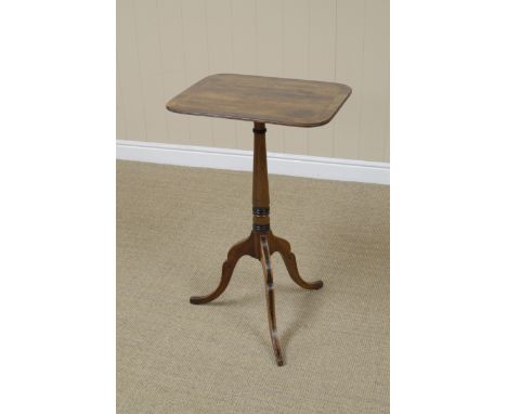 A Regency mahogany Wine Table with cross-banded rounded rectangular top on slender tapering column on partly ebonised tripod 