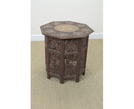 A 19th Century Indian carved octagonal Table with brass inlay and carved vine leaf designs, 2ft