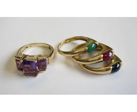 Set of three 14ct gold Rings set sapphire, ruby and emerald cabochons, ring size K-L and an Amethyst three stone Ring in 9ct 