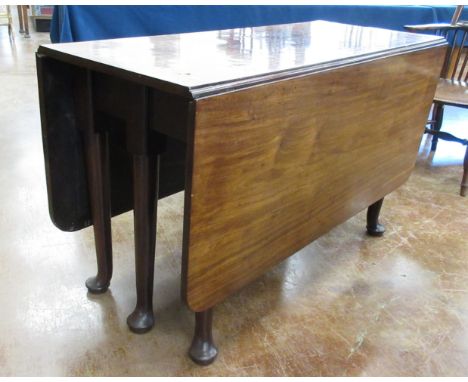 An 18th Century mahogany drop leaf Dining Table on barrel turned supports and pad feet, 5ft L x 4ft W