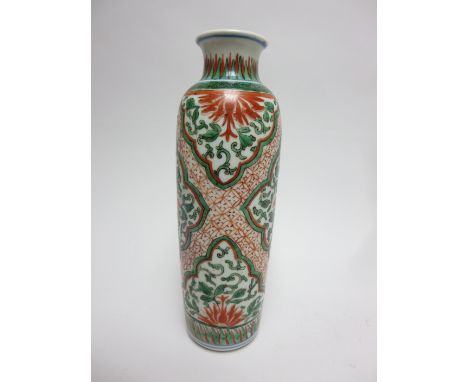 A Chinese Wucai porcelain Vase.Shunzhi (1643 - 1661)Of slender oviform, the waisted neck painted with stiff leaves, above a c