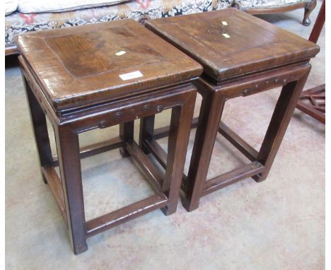 A pair of Chinese elm low Tables of square section with scroll carved top rails. 34 x 34 x 49cm (2)