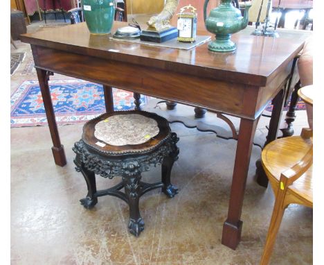 A George III mahogany Serving Table, the rectangular top above a drop frieze raised on chamfered square legs and block feet, 