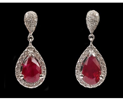 A Pair of Ruby and Diamond Cluster Drop Earrings claw-set pear-cut ruby within frame of pave-set brilliant-cut diamonds suspe