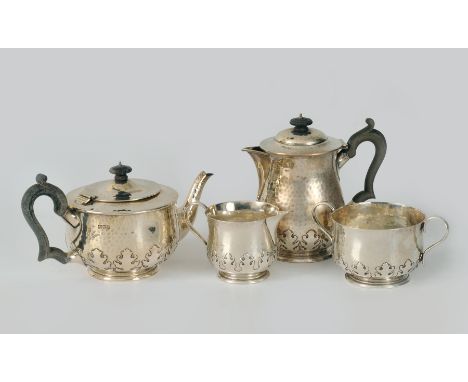 A George V silver four piece Tea and Coffee Service with cut card and hammered design, London 1913, maker: Charles Edwards, r