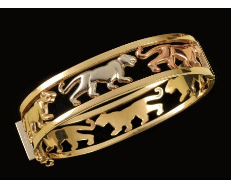 A tri-colour 9ct gold hinged Bangle of panther design, approx 25gms