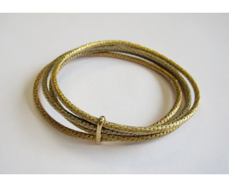 An 18ct gold four coloured Bangle, approx 43gms