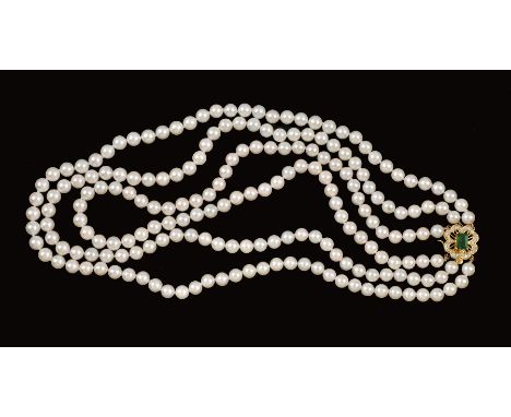 A three strand cultured Freshwater Pearl Necklace on emerald and diamond clasp corner claw-set step-cut emerald in flower hea