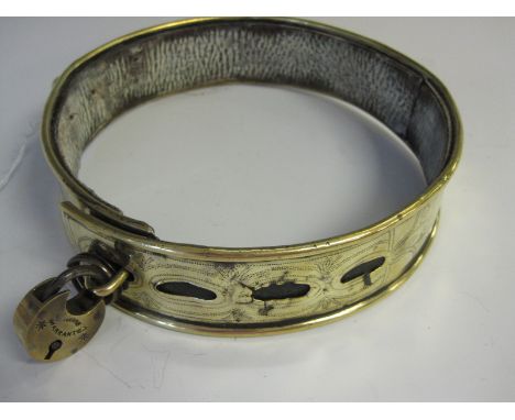 A 19th Century brass and leather lined Dog Collar with engraved hunting scenes and named J. Larry and T. Greaves Nov 1st 1858