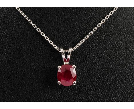 A Ruby Pendant claw set single oval-cut stone, 1.38cts, on fine chain in 18ct white gold.