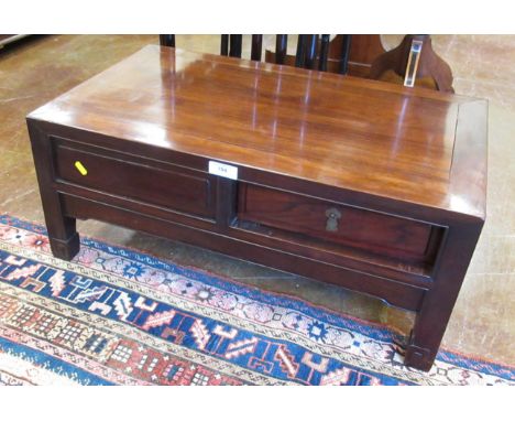 A Chinese hardwood Coffee Table fitted drawer and dummy drawer to each side, on square supports, 2ft 5in W x 1ft 5in D