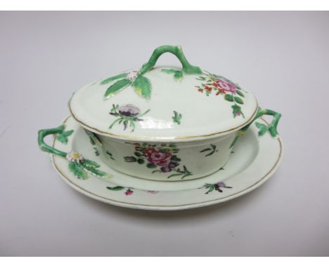 An early Worcester polychrome oval Butter Tub, Cover and Stand floral painted with moulded twig handles, 7 1/2in, petal chips