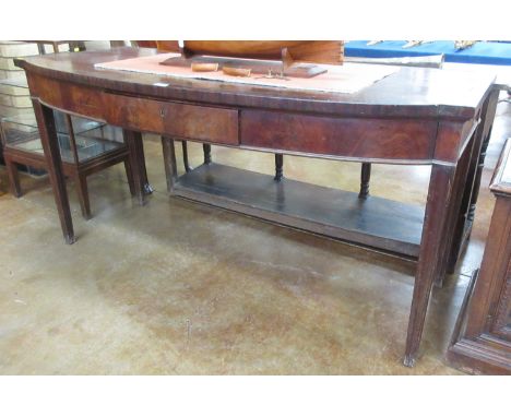 A George III mahogany bow front Serving Table fitted two end drawers and single frieze drawer on square tapering supports, 5f