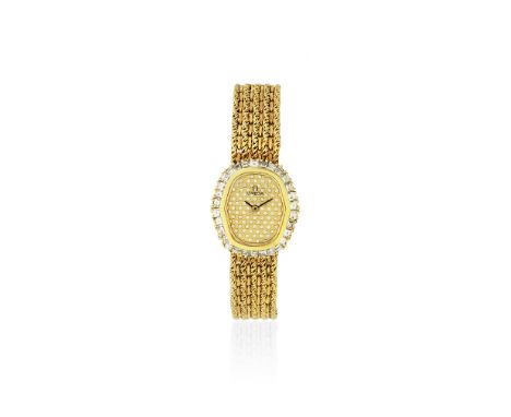 Omega. A lady's 18K gold and diamond set quartz bracelet watchReference: 1450Date: Circa 1984Movement: 10-jewel Cal.1450 quar