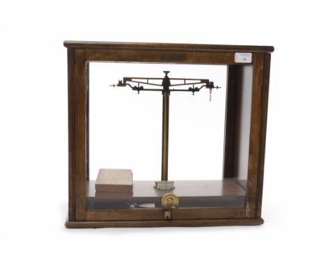 SET OF EARLY 20TH CENTURY BEAM SCALES AND WEIGHTSby W. B. Nicolson of Glasgow, contained within a mahogany glazed case, with 