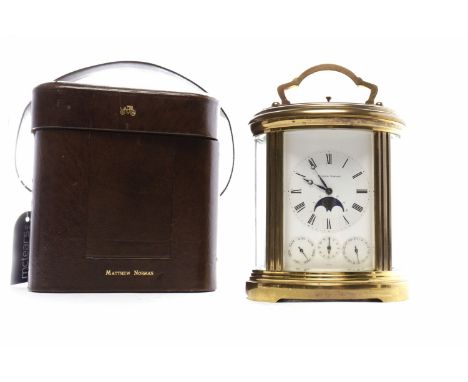 FINE MATTHEW NORMAN FOUR-DIAL BRASS REPEATER CARRIAGE CLOCK with Roman numeral chapter ring, blue steel moon hands, with axe-