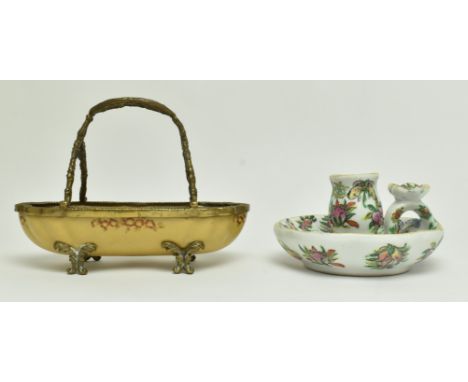 Two vintage Chinese export ceramic centrepieces. The lot comprising a ceramic basket mounted with brass handle, rim and raise