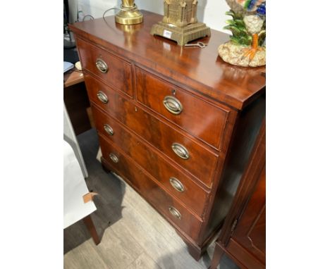 A Mid to late 19th Century mahogany chest of two over three drawers with oval embossed plate handles, ogee bracket feet, 101.