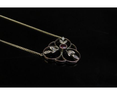 An Edwardian garnet and seed pearl pendant hung on gold chain stamped 9k, 48cm long, 4.4g 