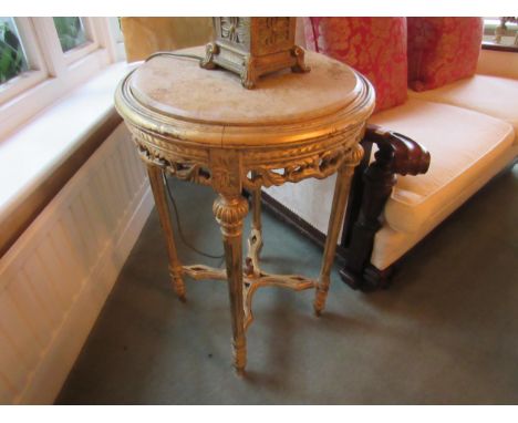A pair of French gilt console tables with marble tops of circular form, melon fluted detail, pierced frieze, 71cm tall x 49cm