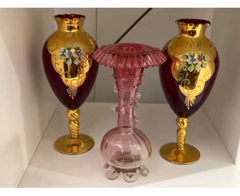 A pair of 20th Century ruby and gilt glass pedestal vases with hand painted floral detail 
