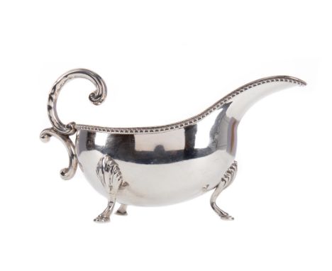 IRISH SILVER SAUCE BOAT, maker Irish Silver Ltd, Dublin 1970, with C-scroll handle on three pad feet, 17cm long, approx. 180g