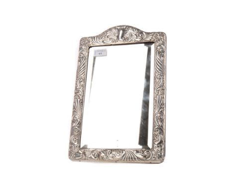 EDWARDIAN SILVER DRESSING TABLE MIRROR, maker Arthur &amp; John Zimmerman Ltd., Birmingham 1902, the frame embossed with scro