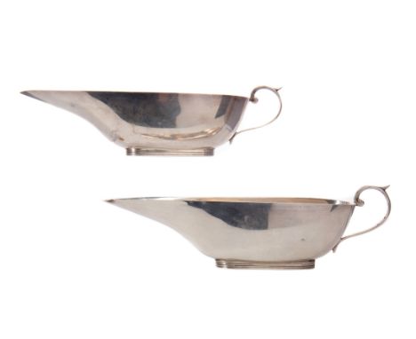 PAIR OF EDWARDIAN SILVER SAUCE BOATS, maker William Aitken, Birmingham 1909, both modelled in the form of a Roman lamp, with 