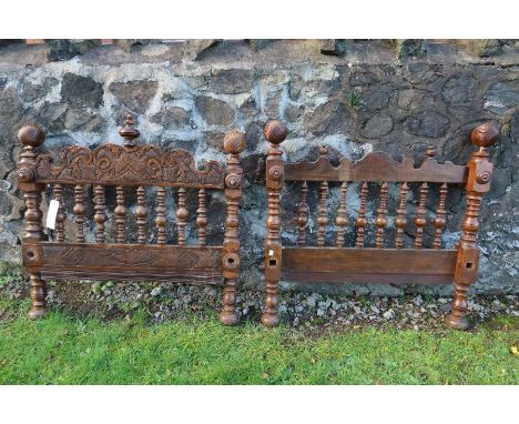 Two single bobbin turned bed ends, with blind fret carvings and turned balls, width 37.5ins