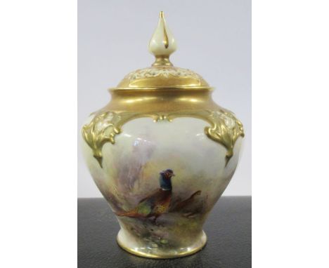 A Royal Worcester covered pot pourri, decorated to the front with pheasants in landscape by Jas Stinton, shape number H279, h